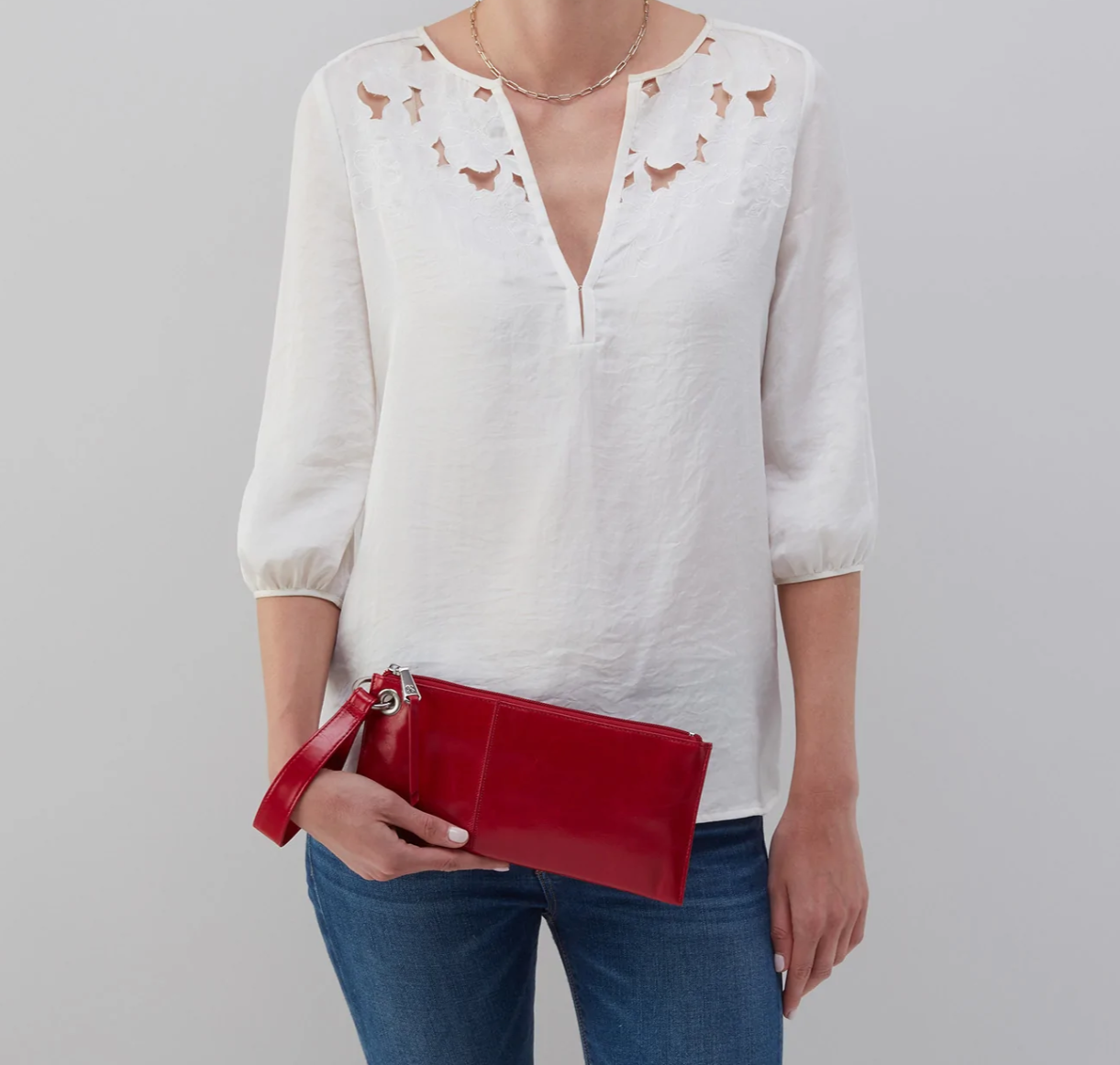 Vida Wristlet Crimson by HOBO features convenient wristlet strap, zipper closure, room for your phone and credit card slots. Shop at The Painted Cottage in Edgewater, MD.